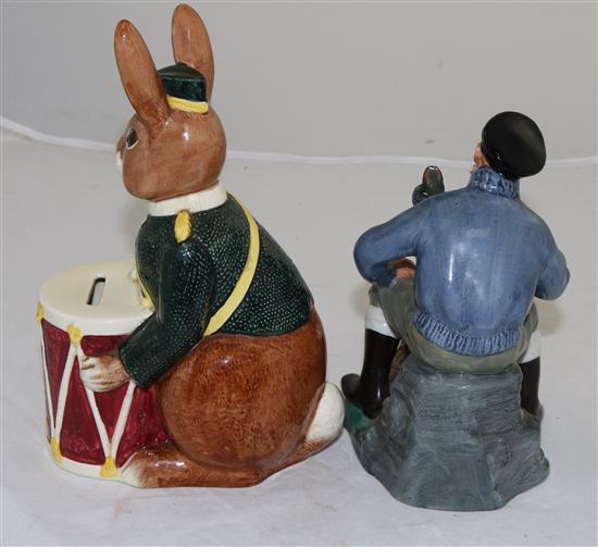 A Royal Doulton Bunnykins bank and a figure The Lobster Man